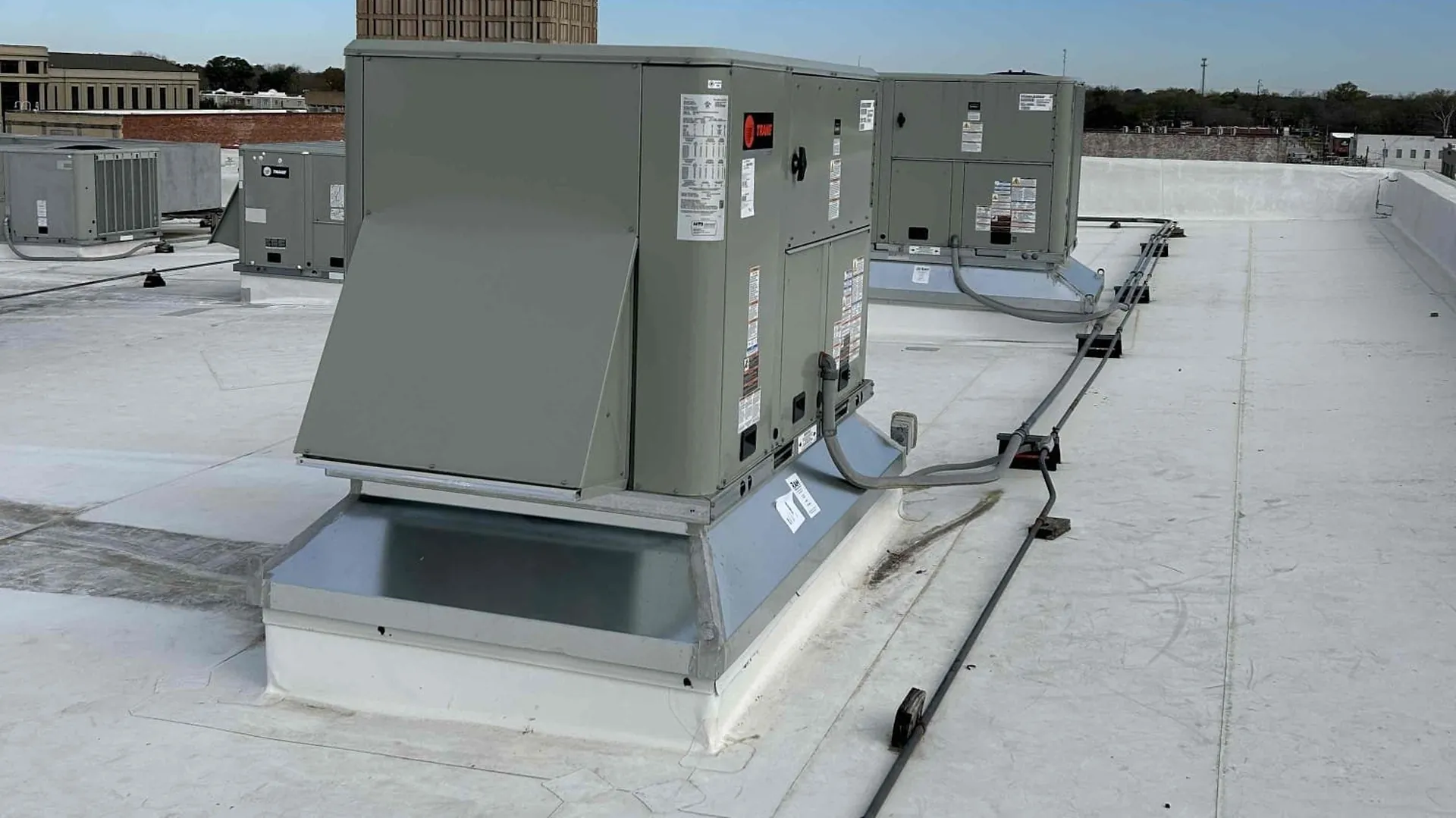 Commercial HVAC units on a flat roof.
